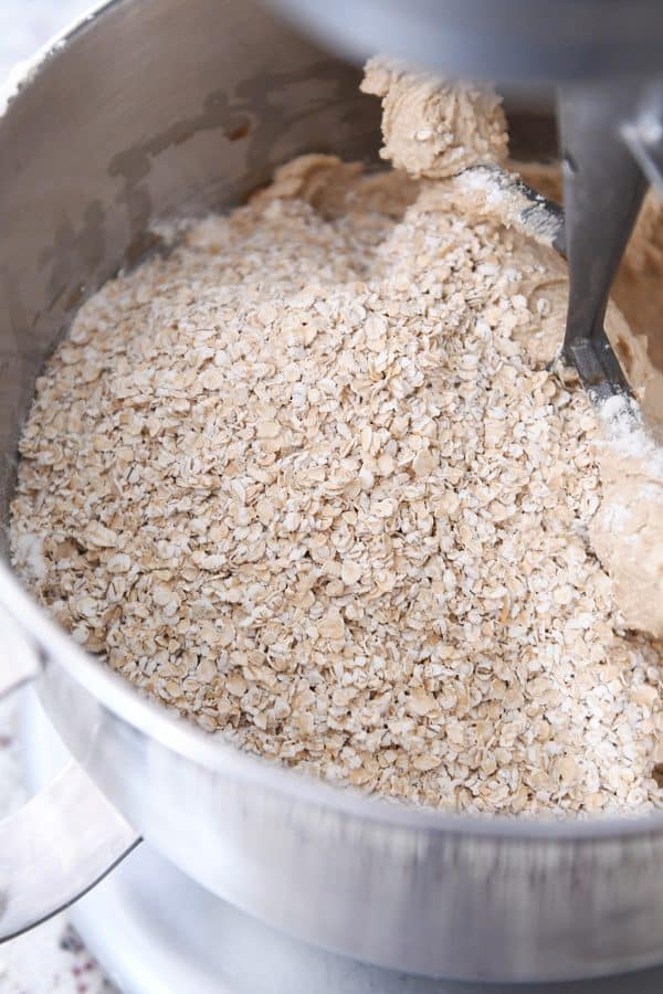 Stand mixer with quick oats added to the homemade oatmeal cream pies batter.