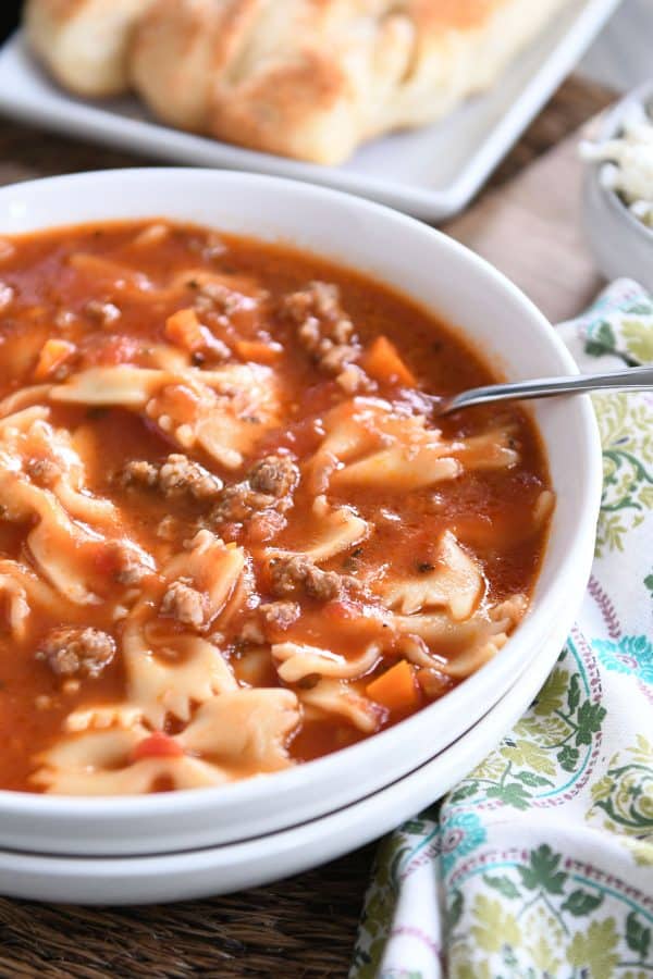 White bowl filled with pressure cooker lasagna soup.