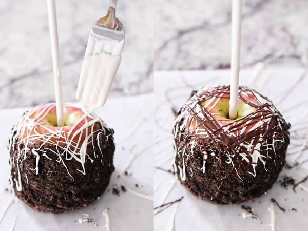 Drizzling white chocolate on homemade caramel apple with Oreo crumbs.
