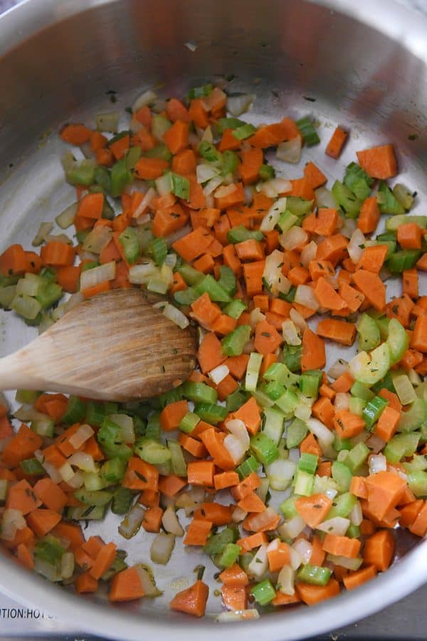 Sauteeing carrots, celery and onions for the best leftover turkey soup.