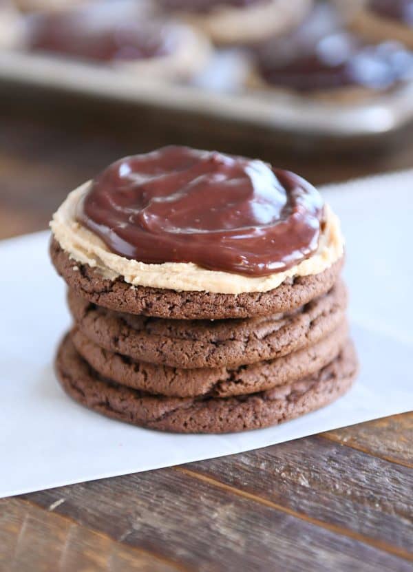 Stack of four chocolate peanut butter buckeye cookies.