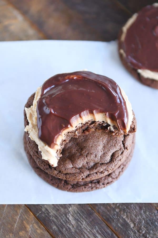 Stack of chocolate peanut butter buckeye cookies with bite taken out