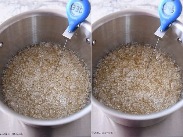 Cooking sugar syrup for caramels in a metal pot with a candy thermometer.