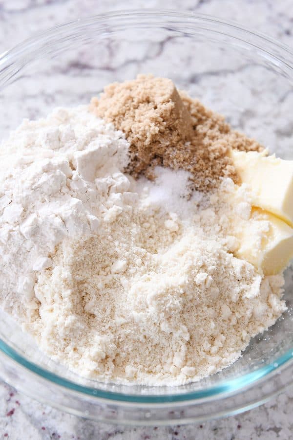 Ingredients in glass bowl to make shortbread crust.