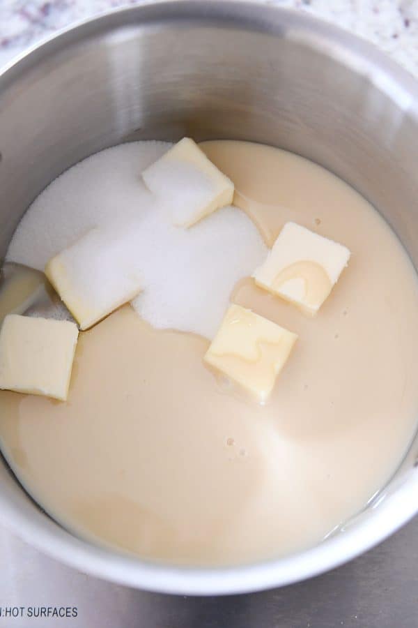 Adding sweetened condensed milk, butter and sugar.