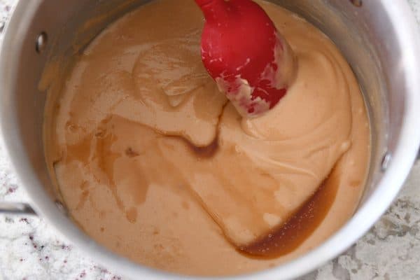 Stirring vanilla into homemade caramel