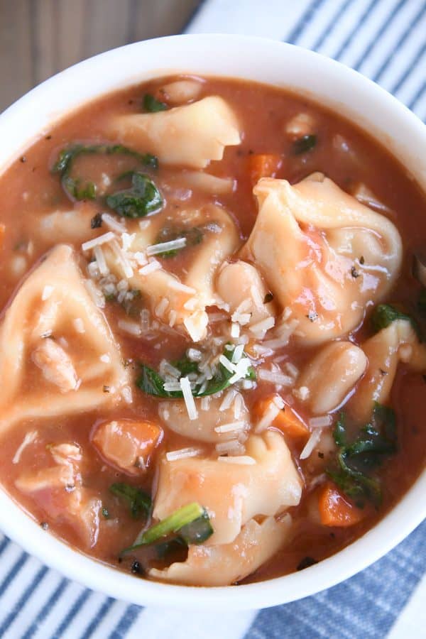 Top down view of creamy tuscan tortellini soup.