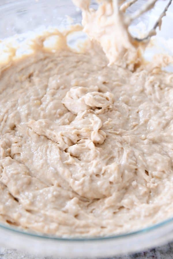 Mixed banana coffee cake batter in a glass bowl.