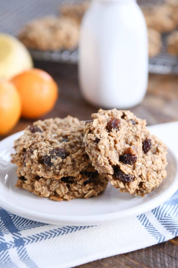 Baked breakfast cookies with raisins on a white plate.