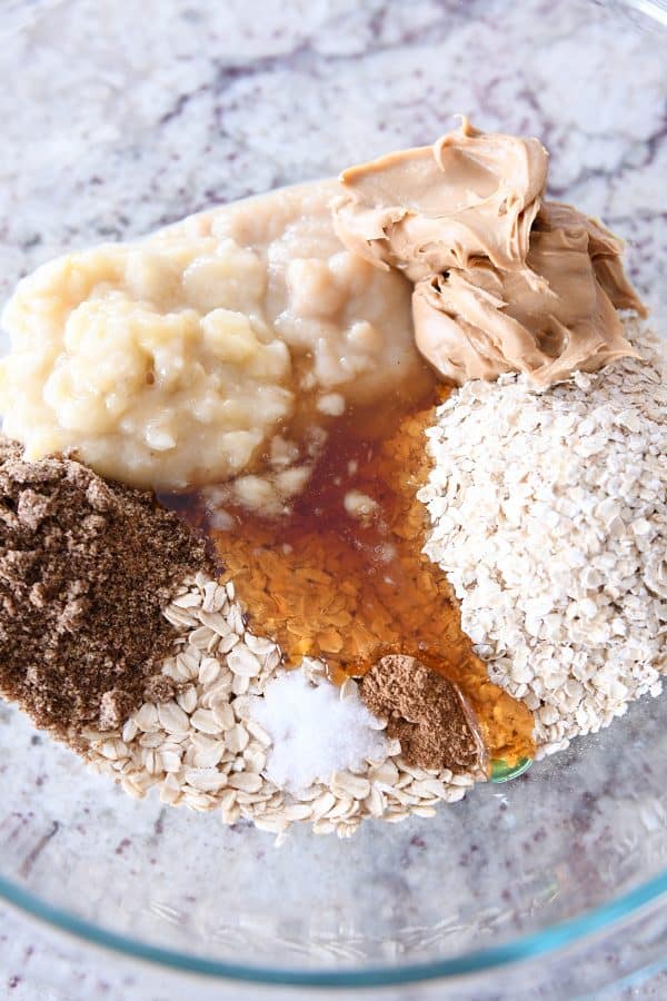 All the ingredients for healthy breakfast cookies in glass bowl.