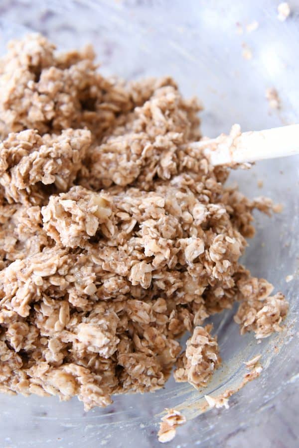 Raw oat cookie dough in a glass bowl.