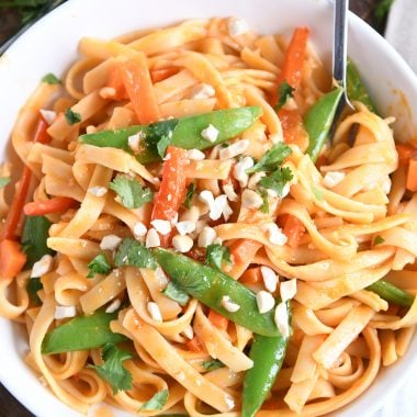 twirling instant pot red coconut curry noodles with fork