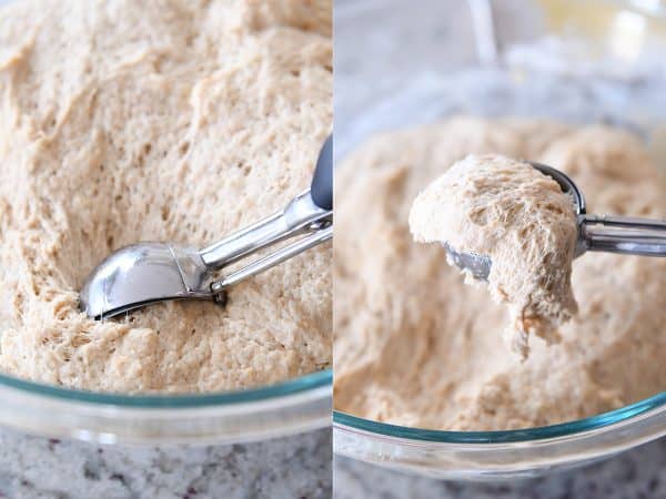 Scooping out wet english muffin dough with cookie scoop.