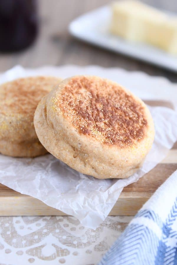 Easy homemade english muffins on parchment paper.