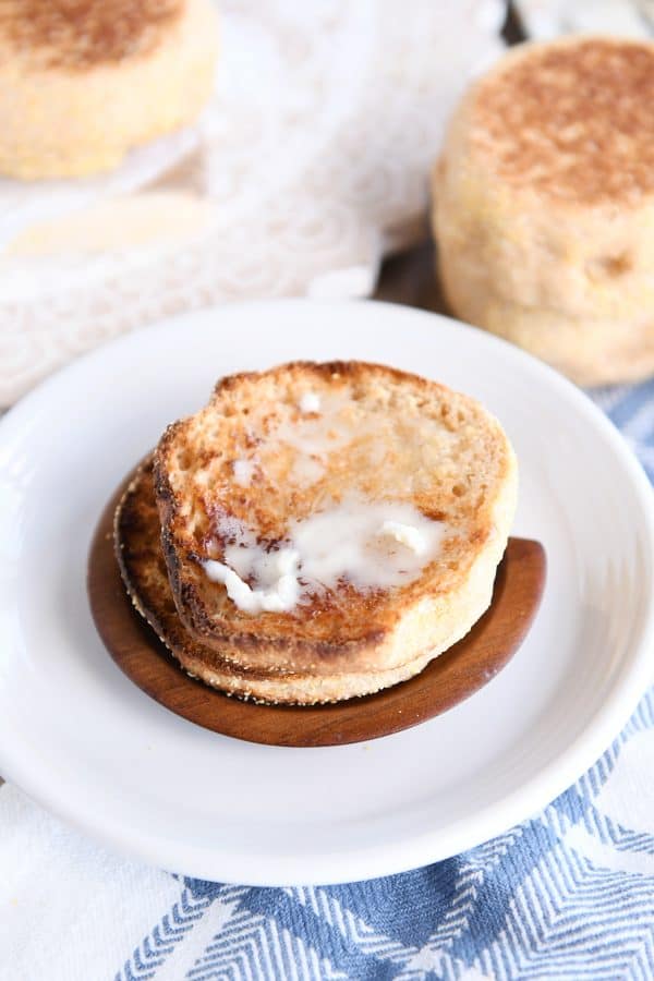 homemade english muffin split open and toasted with butter