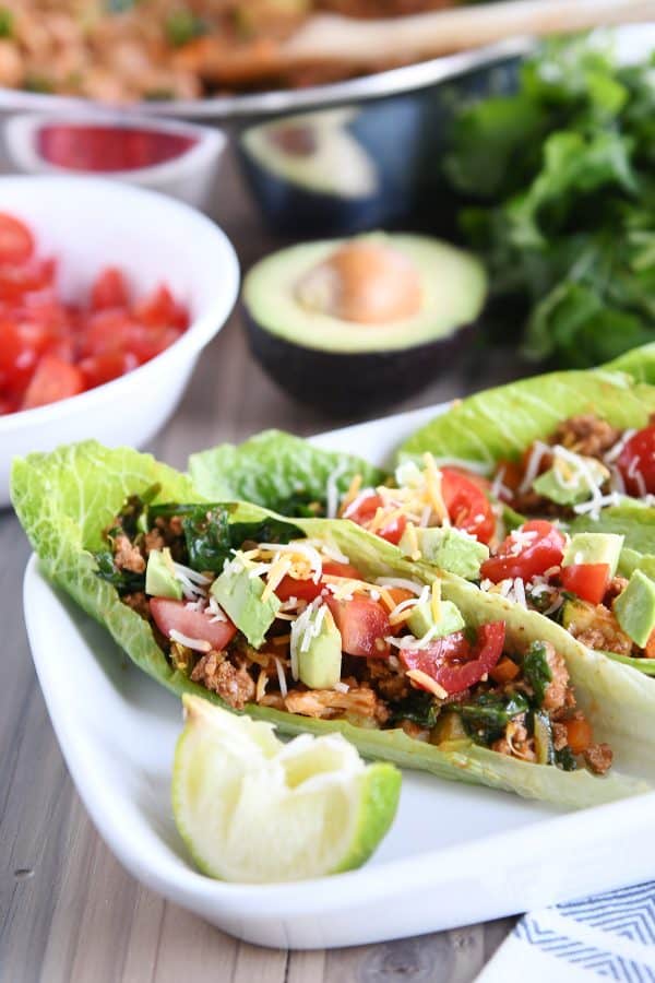 Veggie turkey taco lettuce wraps on white tray.