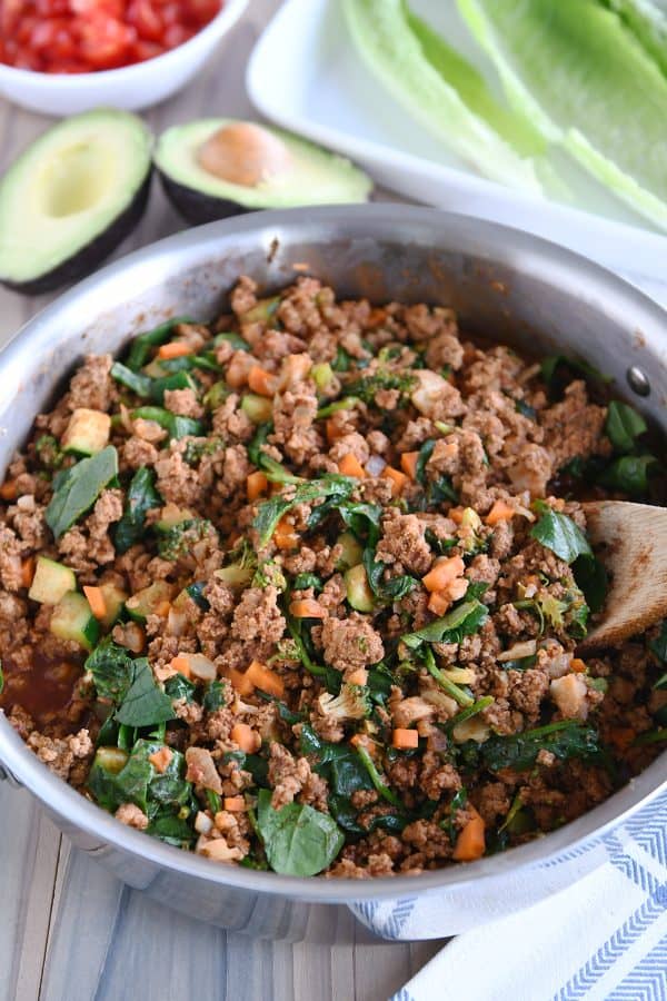 Pan full of filling for veggie turkey taco lettuce wraps.