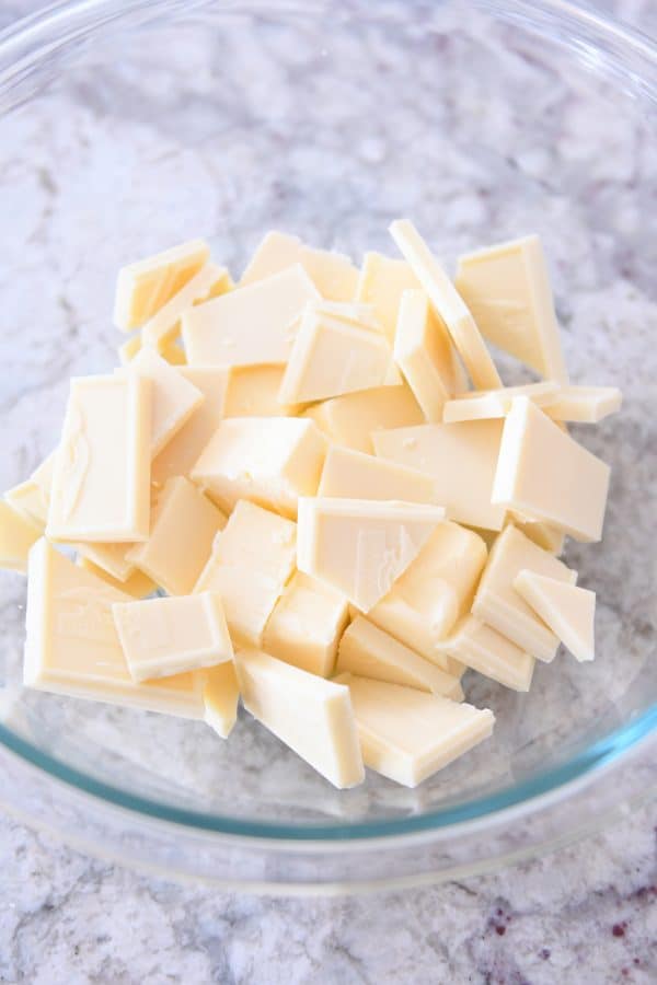 White chocolate and butter in glass bowl.