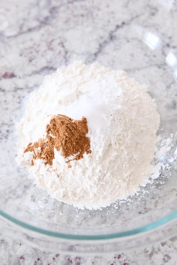 Dry ingredients for banana muffins in a glass bowl. 