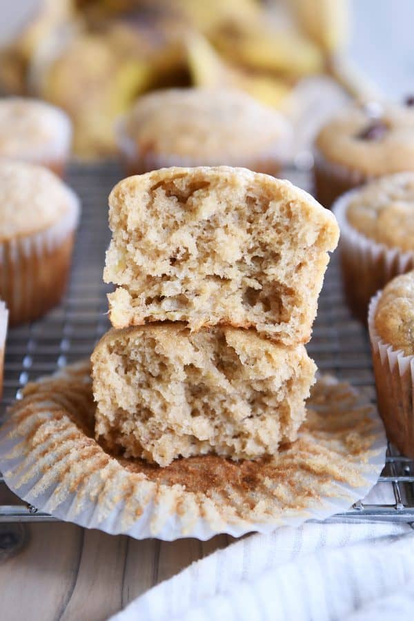 the best banana muffins - muffin split in half and stacked on each other