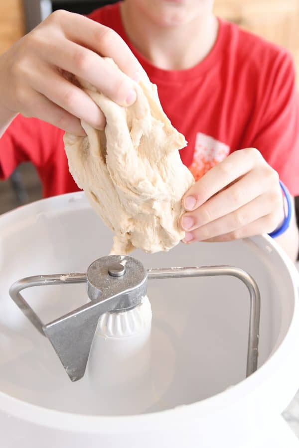 pulling pretzel dough out of bosch mixer