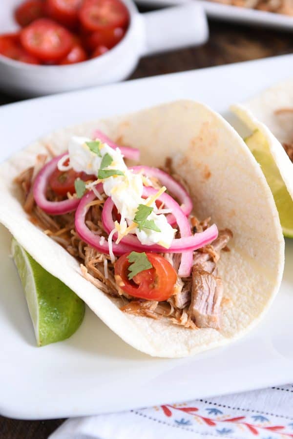 taco made from instant pot bbq pork taco meat and pickled onions