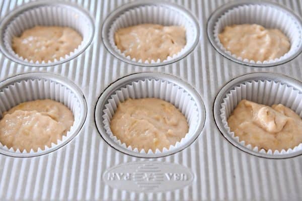 unbaked banana muffin batter in muffin liners