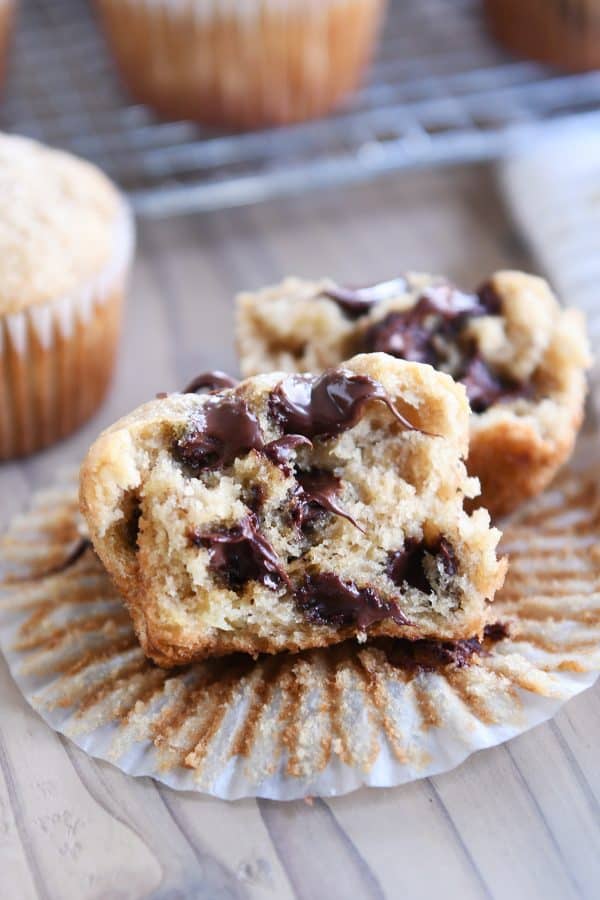 Banana muffin with chocolate chips unwrapped and split in half.