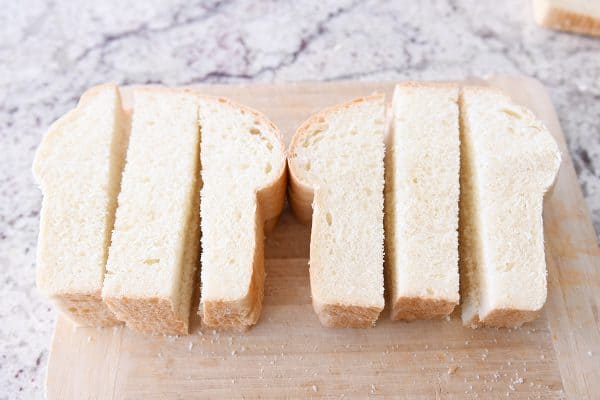 Thick white bread sliced into sticks for crunchy baked french toast sticks.