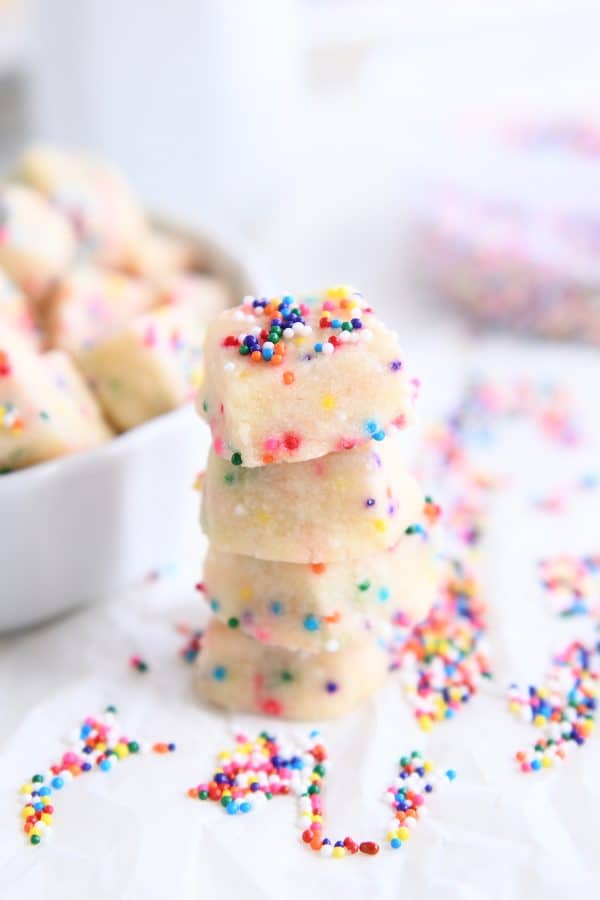 Stack of baked funfetti shortbread bites.