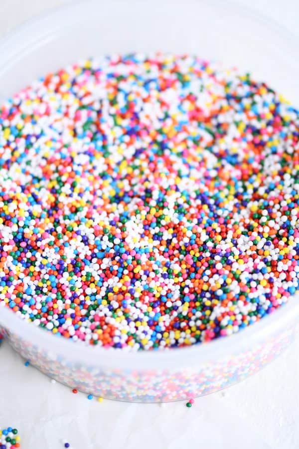 Bowl of colorful nonpareil sprinkles.