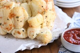 buttery garlic + herb pull-apart bubble bread with pieces on the side