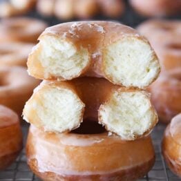 the best homemade glazed donuts with one broken in half