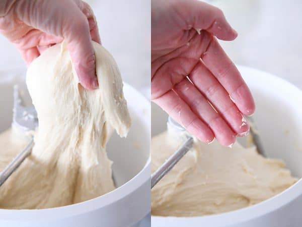 Lifting dough out of bosch for the best homemade glazed donuts recipe.