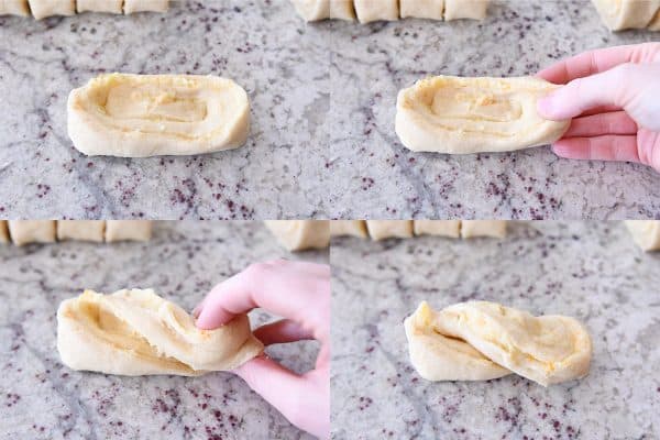 How to shape homemade orange sweet rolls into a twist shape.