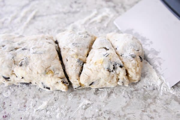 Cutting scone dough into triangles.