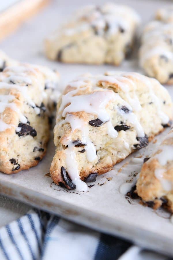 Several chocolate chip banana bread scones on baking sheet.