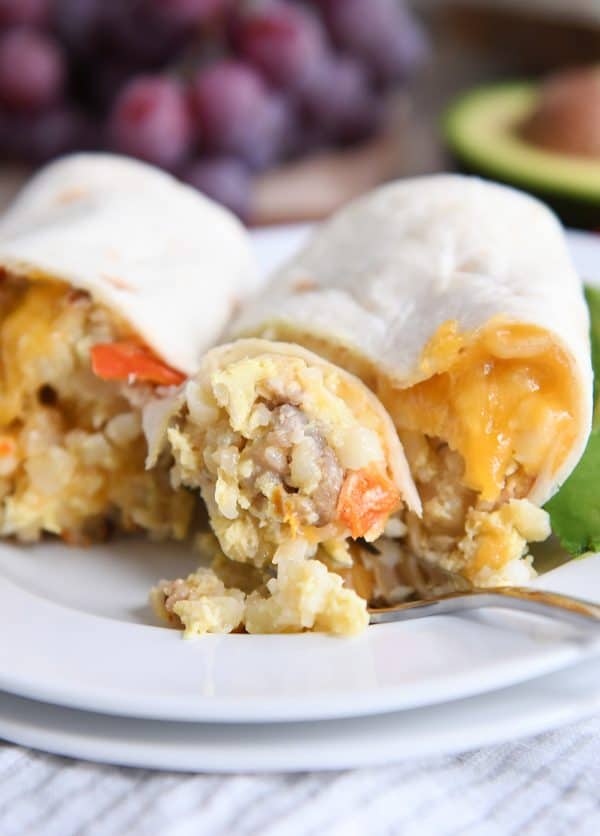 easy freezer breakfast burrito cut in half with bite on fork