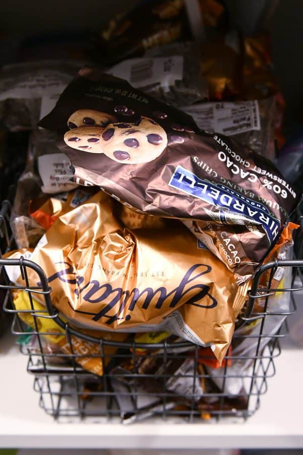 chocolate chips in wire basket in pantry