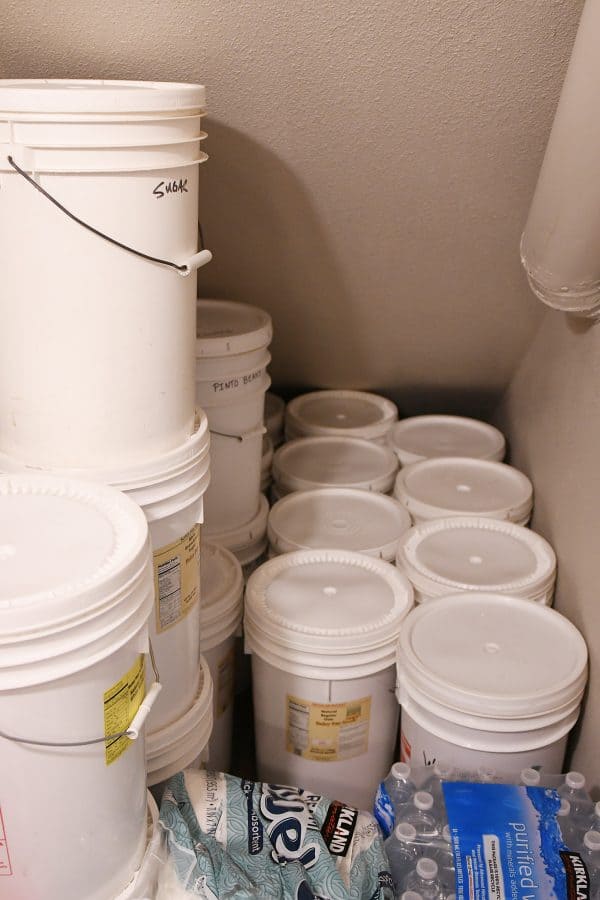 lots of 5 gallon buckets on floor of pantry