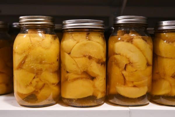 home canned peaches on shelf