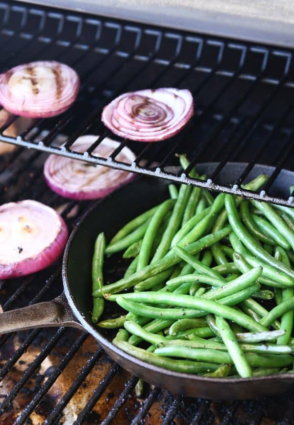 Grilling green beans in cast iron skillet.
