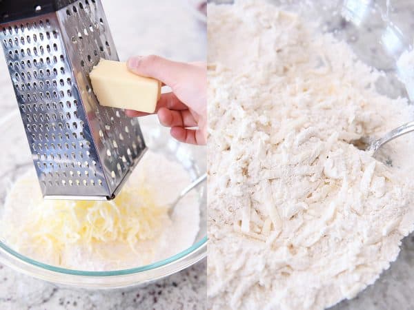 Grating butter with cheese grater into dry ingredients.