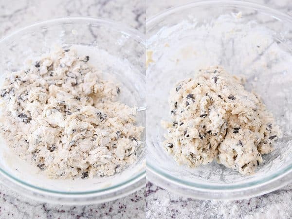 Mixing chocolate chunk biscuit dough in glass bowl.