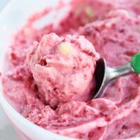scooping out pink sorbet with ice cream sorbet