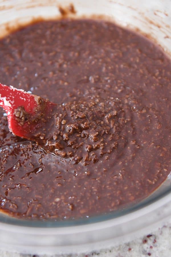 No-bake peanut butter coconut mixture in glass bowl.