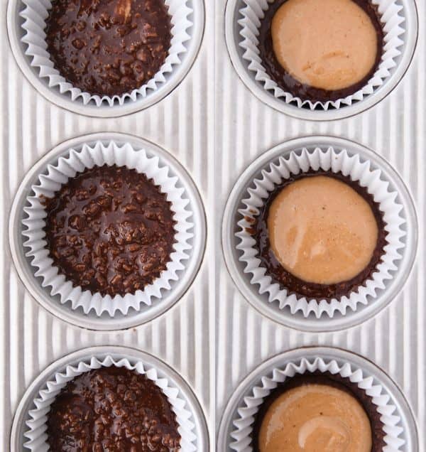 Chocolate no-bake mixture in muffin liners with peanut butter mixture on top.