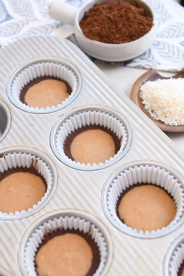 No-bake peanut butter cups in liners in muffin tin.