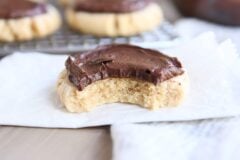 peanut butter sugar cookie with chocolate frosting on white napkin