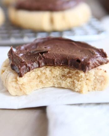 peanut butter sugar cookie with chocolate frosting on white napkin